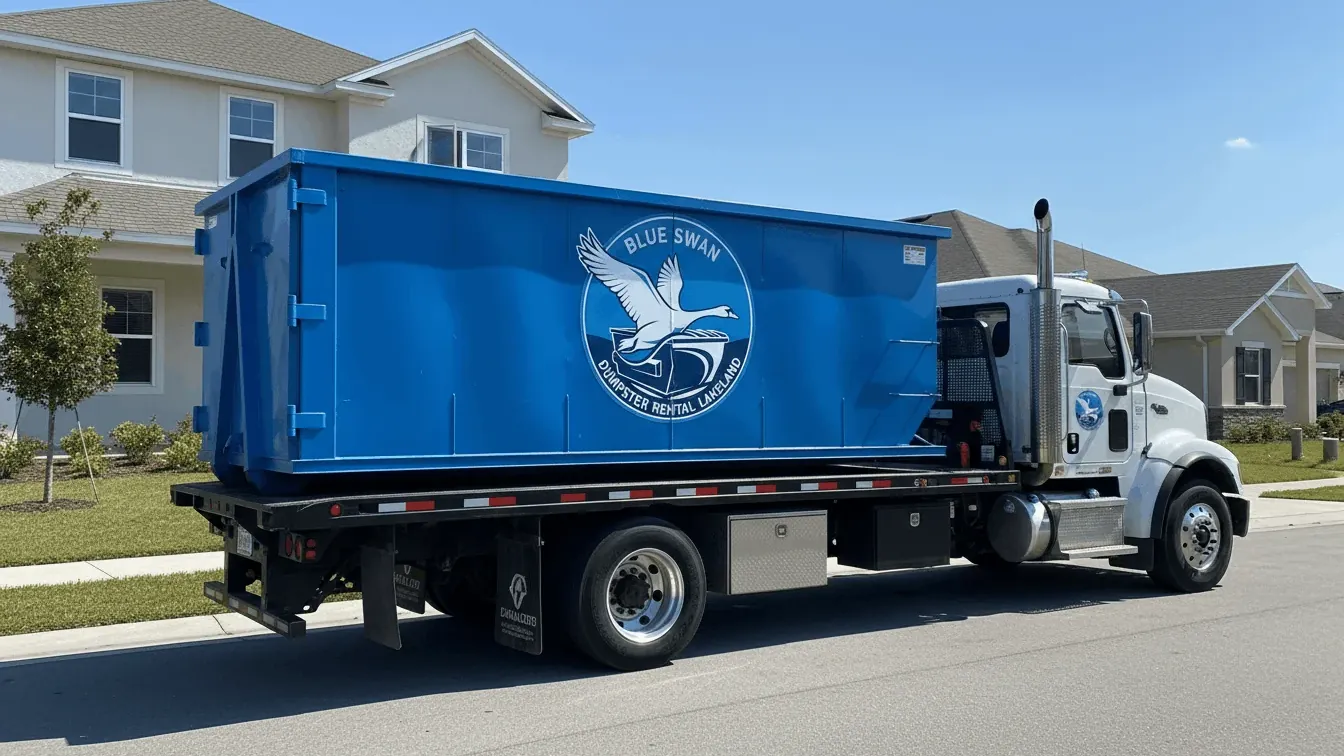 Roll-off truck delivering a 30 yard dumpster on a residential street in Lakeland, FL Roll-off truck delivering a 30 yard dumpster on a residential street in Lakeland, FL