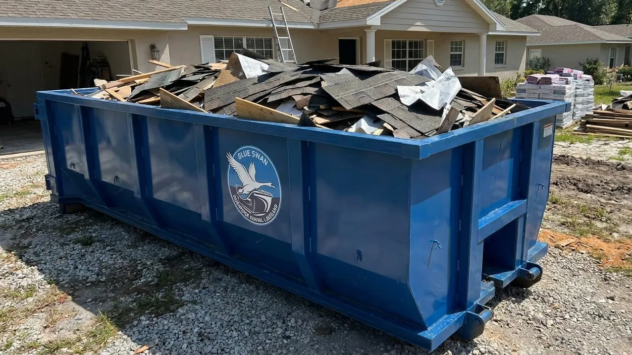 Storm debris cleanup in Lakeland, Florida — wind and rain debris loaded after a storm crosses the peninsula